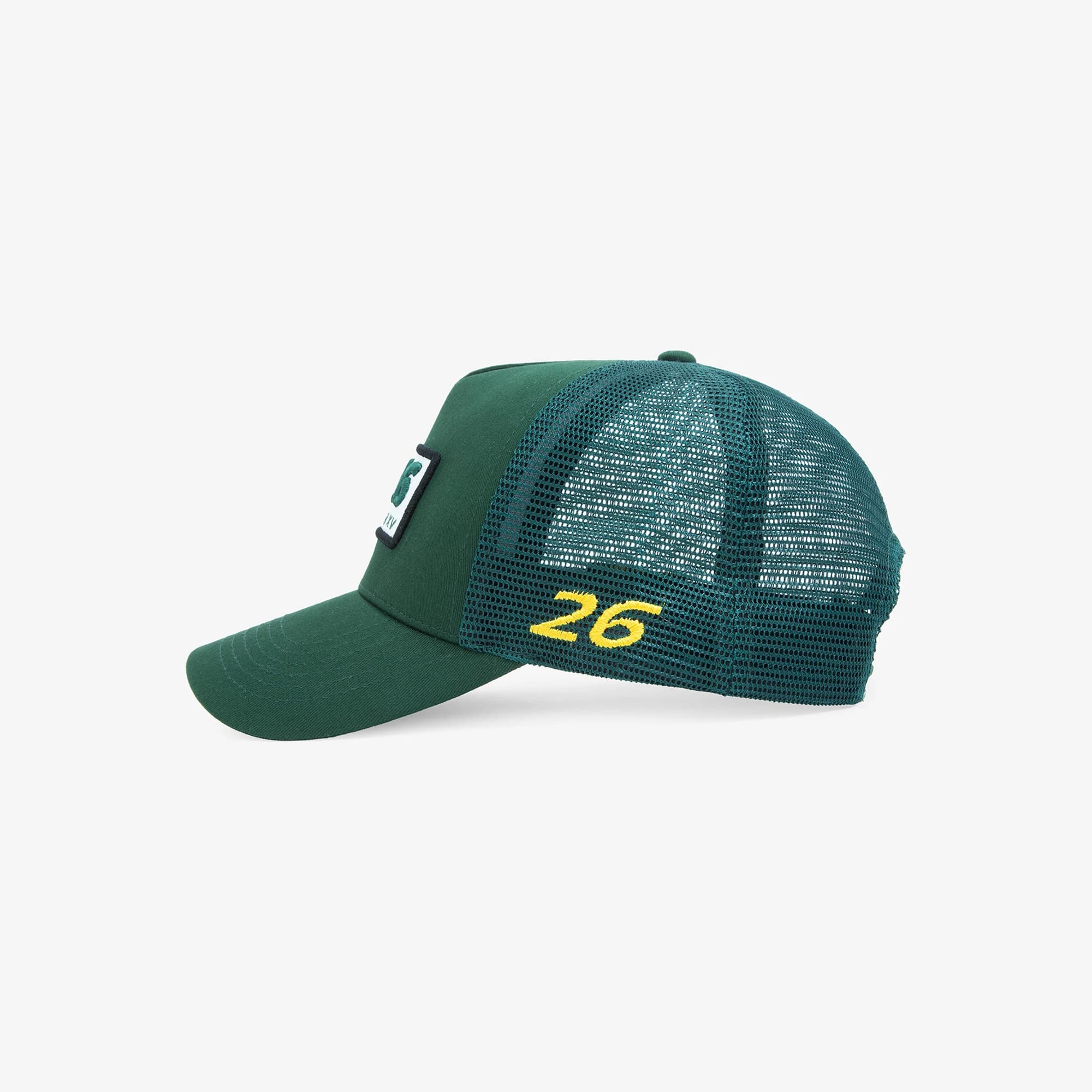 SIX2SIX ET26 trucker cap in green, side view, with a yellow 26 embroidered on the mesh
